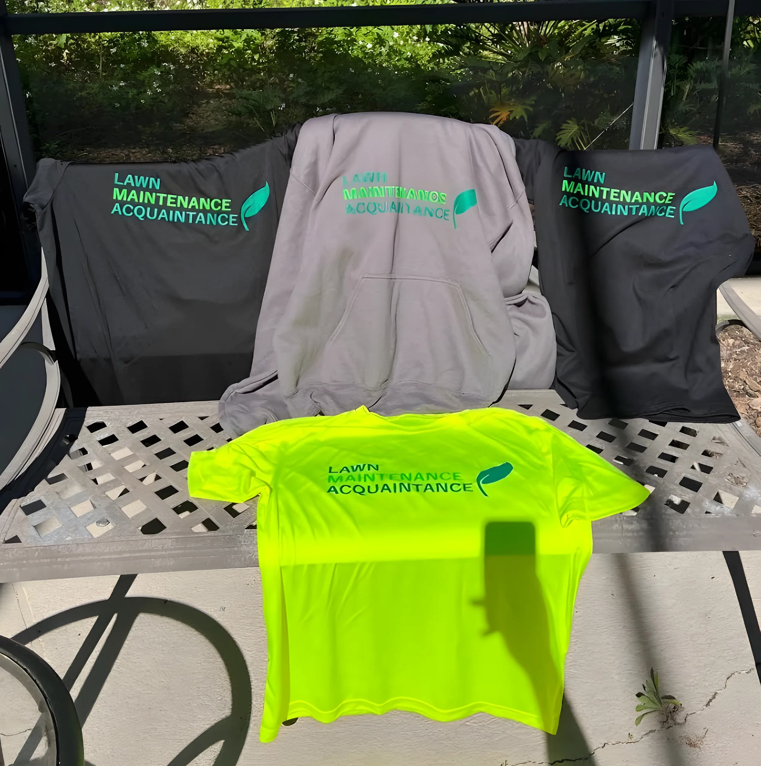 LMA crew shirts laid out on a bench