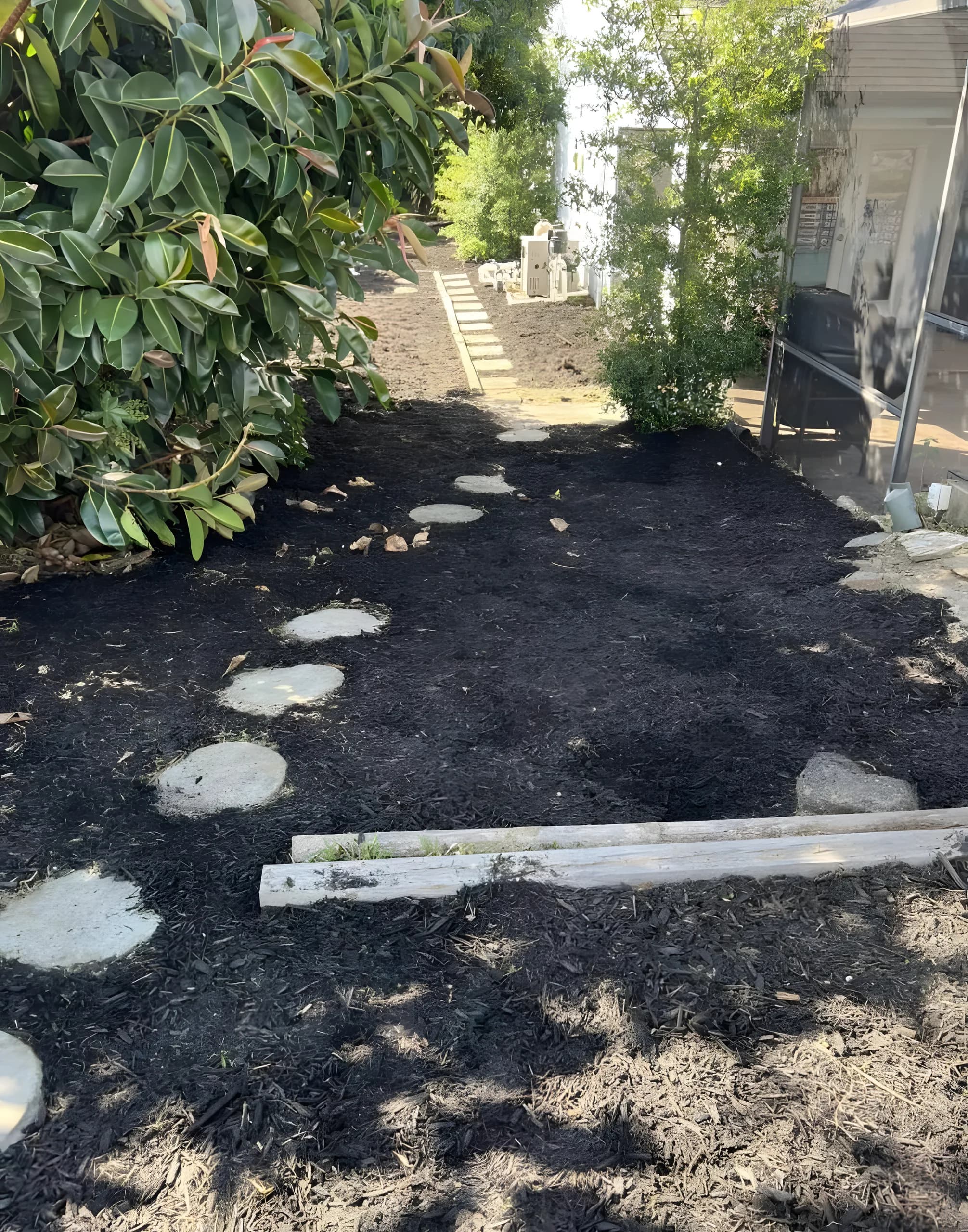Black mulch path with stepping stones
